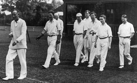 Hardy leading out his cricket team: "The Mathematicals" to play against "The Rest of the World".
 